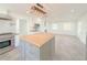 Modern kitchen features a butcher block island and stainless steel appliances at 2827 Sanctuary Ln, Winter Garden, FL 34787