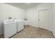 Laundry room with washer, dryer, and utility sink at 2827 Sanctuary Ln, Winter Garden, FL 34787