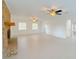 Open living room with brick fireplace and hardwood floors at 2827 Sanctuary Ln, Winter Garden, FL 34787