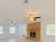 Bright living room with brick fireplace and ceiling fans at 2827 Sanctuary Ln, Winter Garden, FL 34787