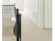 View of a renovated staircase with dark wood railing and light flooring at 2827 Sanctuary Ln, Winter Garden, FL 34787