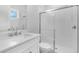 Modern bathroom featuring a glass shower and vanity with bright natural light and white fixtures at 2983 Arranmore Dr, Ormond Beach, FL 32174
