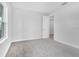 Bedroom with neutral carpet and light grey walls featuring bright natural light and a walk-in closet at 2983 Arranmore Dr, Ormond Beach, FL 32174