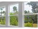 View of trees and the Florida landscape from a new construction home with three windows at 2983 Arranmore Dr, Ormond Beach, FL 32174