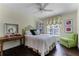 Cozy bedroom with a comfortable bed and seating area at 3791 Brantley Place Cir, Apopka, FL 32703