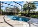 Refreshing screened pool with a water feature, surrounded by lush landscaping at 3791 Brantley Place Cir, Apopka, FL 32703