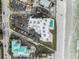 Aerial view showing building, pool, parking and beach at 421 S Atlantic Ave # 105, New Smyrna Beach, FL 32169