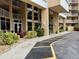 Exterior entrance of the building featuring landscaping and convenient parking access at 421 S Atlantic Ave # 105, New Smyrna Beach, FL 32169