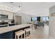 Modern kitchen with stainless steel appliances and island at 421 S Atlantic Ave # 105, New Smyrna Beach, FL 32169
