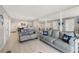 Open living area with light wood floors and view into kitchen at 421 S Atlantic Ave # 105, New Smyrna Beach, FL 32169