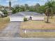 Ranch-style home with driveway and mature landscaping at 507 Applewood Ave, Altamonte Springs, FL 32714