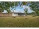 Large backyard with grassy lawn and screened porch at 507 Applewood Ave, Altamonte Springs, FL 32714