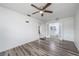 Spacious bedroom with wood-look floors and access to bathroom at 507 Applewood Ave, Altamonte Springs, FL 32714