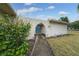 Front entry with an arched walkway and blue door at 507 Applewood Ave, Altamonte Springs, FL 32714