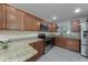 Updated kitchen featuring granite countertops and stainless steel appliances at 507 Applewood Ave, Altamonte Springs, FL 32714
