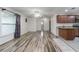 Open concept living space with hardwood floors and kitchen access at 507 Applewood Ave, Altamonte Springs, FL 32714