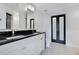 Modern bathroom with double vanity, granite countertop, and a walk-in shower at 630 Vassar St # 2310, Orlando, FL 32804