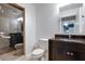 Modern bathroom with dark vanity, granite countertop and a walk-in shower at 630 Vassar St # 2310, Orlando, FL 32804