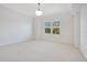 Bright and spacious bedroom with carpeting and window shutters at 630 Vassar St # 2310, Orlando, FL 32804