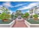 Community courtyard with brick pavers, benches, landscaping, and unit views at 630 Vassar St # 2310, Orlando, FL 32804