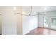 Elegant dining room featuring hardwood floors and a modern chandelier at 630 Vassar St # 2310, Orlando, FL 32804