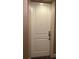 Neutral-colored unit entry door with silver hardware and a simple design at 630 Vassar St # 2310, Orlando, FL 32804