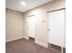 Hallway with two white doors at 630 Vassar St # 2310, Orlando, FL 32804