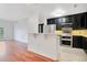 Modern kitchen with dark cabinetry and stainless steel appliances at 630 Vassar St # 2310, Orlando, FL 32804