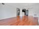 Living room with hardwood floors and access to kitchen at 630 Vassar St # 2310, Orlando, FL 32804