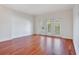 Spacious living room featuring hardwood floors and French doors at 630 Vassar St # 2310, Orlando, FL 32804