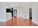 Open concept living area with hardwood floors and chandelier at 630 Vassar St # 2310, Orlando, FL 32804