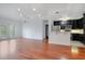 Open concept living room and kitchen with hardwood floors at 630 Vassar St # 2310, Orlando, FL 32804