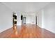 Expansive living space with hardwood floors, stylish lighting, and an open flow into the modern kitchen at 630 Vassar St # 2310, Orlando, FL 32804