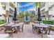 Community patio with seating and umbrellas at 630 Vassar St # 2310, Orlando, FL 32804