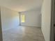 Bright and spacious bedroom with tile flooring and a window at 6365 Sw 156 Th St St, Ocala, FL 34473