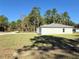 Side view of a newly built light green house with grassy yard at 6365 Sw 156 Th St St, Ocala, FL 34473