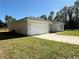 New construction home with a two-car garage and a grassy lawn at 6365 Sw 156 Th St St, Ocala, FL 34473