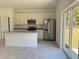 Modern kitchen with stainless steel appliances and an island at 6365 Sw 156 Th St St, Ocala, FL 34473