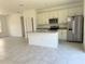 Modern kitchen with stainless steel appliances and an island at 6365 Sw 156 Th St St, Ocala, FL 34473
