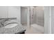 Bright bathroom with a double sink vanity and a modern glass-enclosed shower at 7100 Cherry Pasture Rd, Groveland, FL 34736