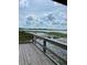 Wooden deck overlooking lake with lily pads at 7100 Cherry Pasture Rd, Groveland, FL 34736