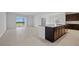 Open concept living space featuring tile flooring and sliding doors to the exterior at 7100 Cherry Pasture Rd, Groveland, FL 34736