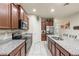 Modern kitchen with granite countertops and stainless steel appliances at 10248 Sand Cay Dr, Winter Garden, FL 34787