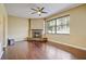 Living room with corner fireplace and hardwood floors at 11513 Robbyes Dr, Orlando, FL 32817