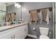 Double vanity bathroom with granite countertop and large mirror at 1253 15Th St, Orange City, FL 32763