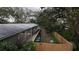 Backyard view showing a deck and fenced-in area at 13811 County Road 109D, Lady Lake, FL 32159
