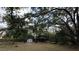 Backyard with covered storage and a storage shed at 13811 County Road 109D, Lady Lake, FL 32159
