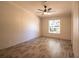 Bedroom with ceiling fan and natural light; updated wood look flooring at 13811 County Road 109D, Lady Lake, FL 32159