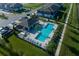 Community pool with cabana and surrounding green space at 14914 Harvest St, Orlando, FL 32824