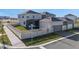 Aerial view of a house with a fenced yard, screened lanai, and garage at 15005 Lake Bessie Loop, Winter Garden, FL 34787